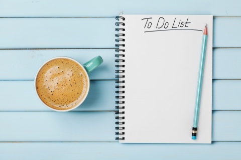 cup of coffee and to do list notepad