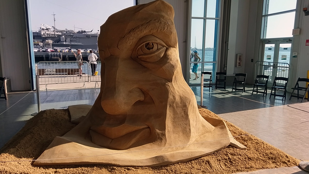 half face sand sculpture
