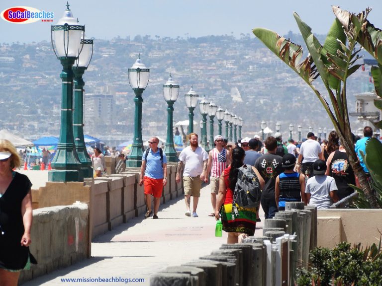 people walking on mission beach boardwalk san diego