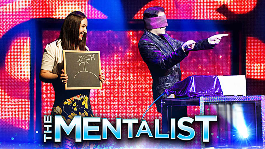 man with purple blindfold and woman holding board with drawing on the mentalist event