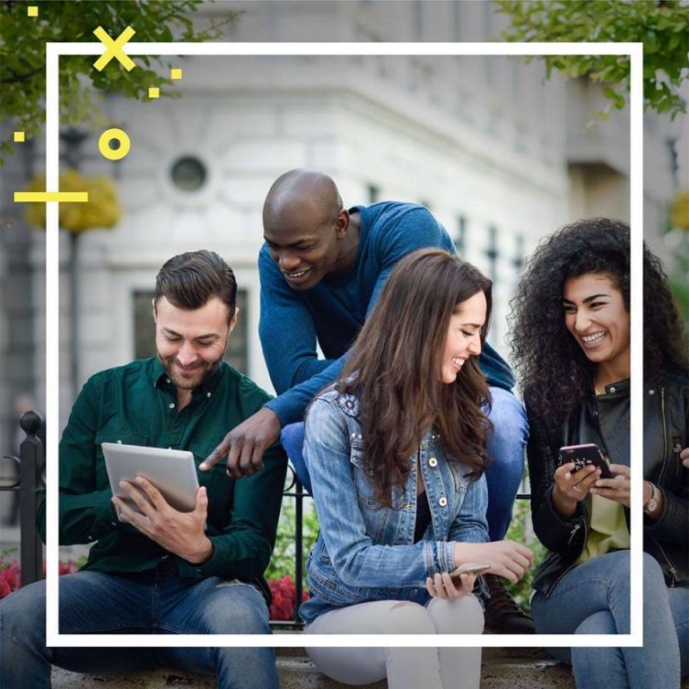 people holding their mobile phone and tablet smiling each other