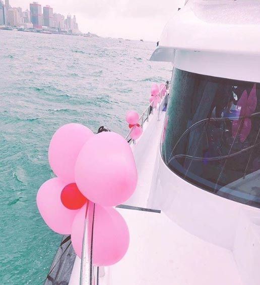 a boat and balloons on the side