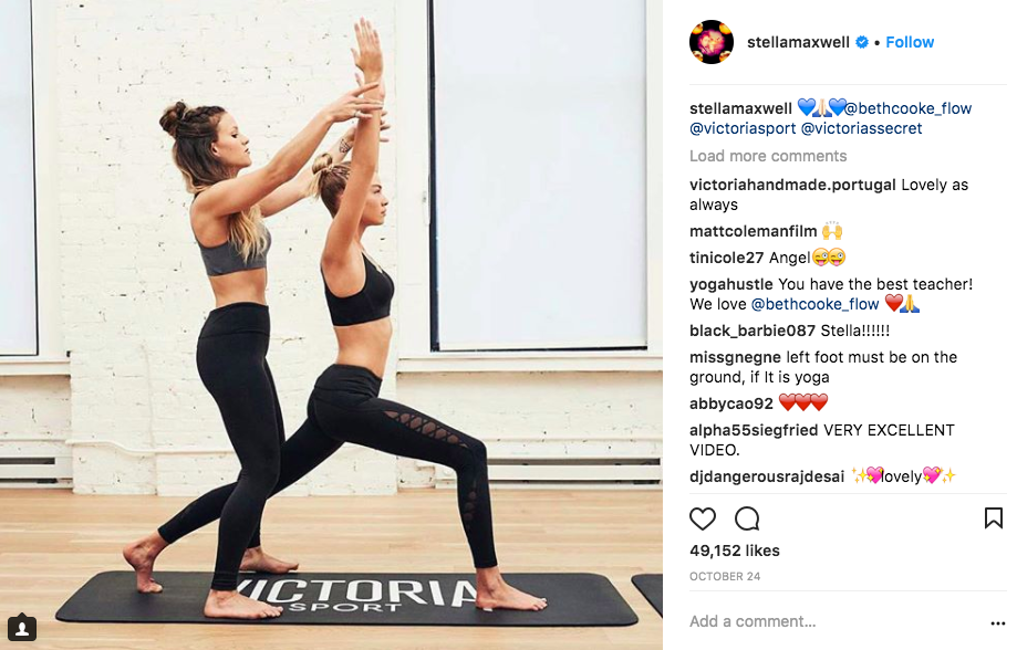 photo of two women practicing yoga