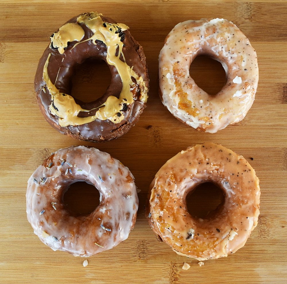 four pieces of different donuts