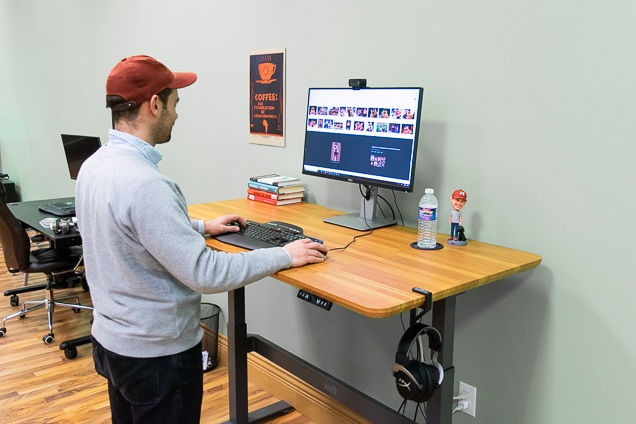 an employee working on stand-up desk