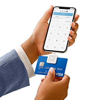 smartphone credit card reader and blue visa card
