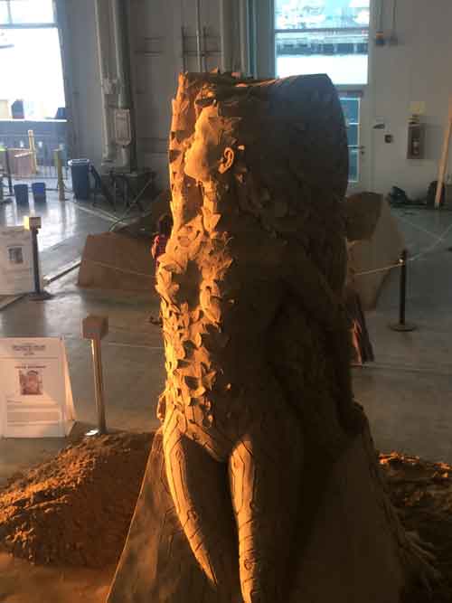 a woman sand sculpture in the museum
