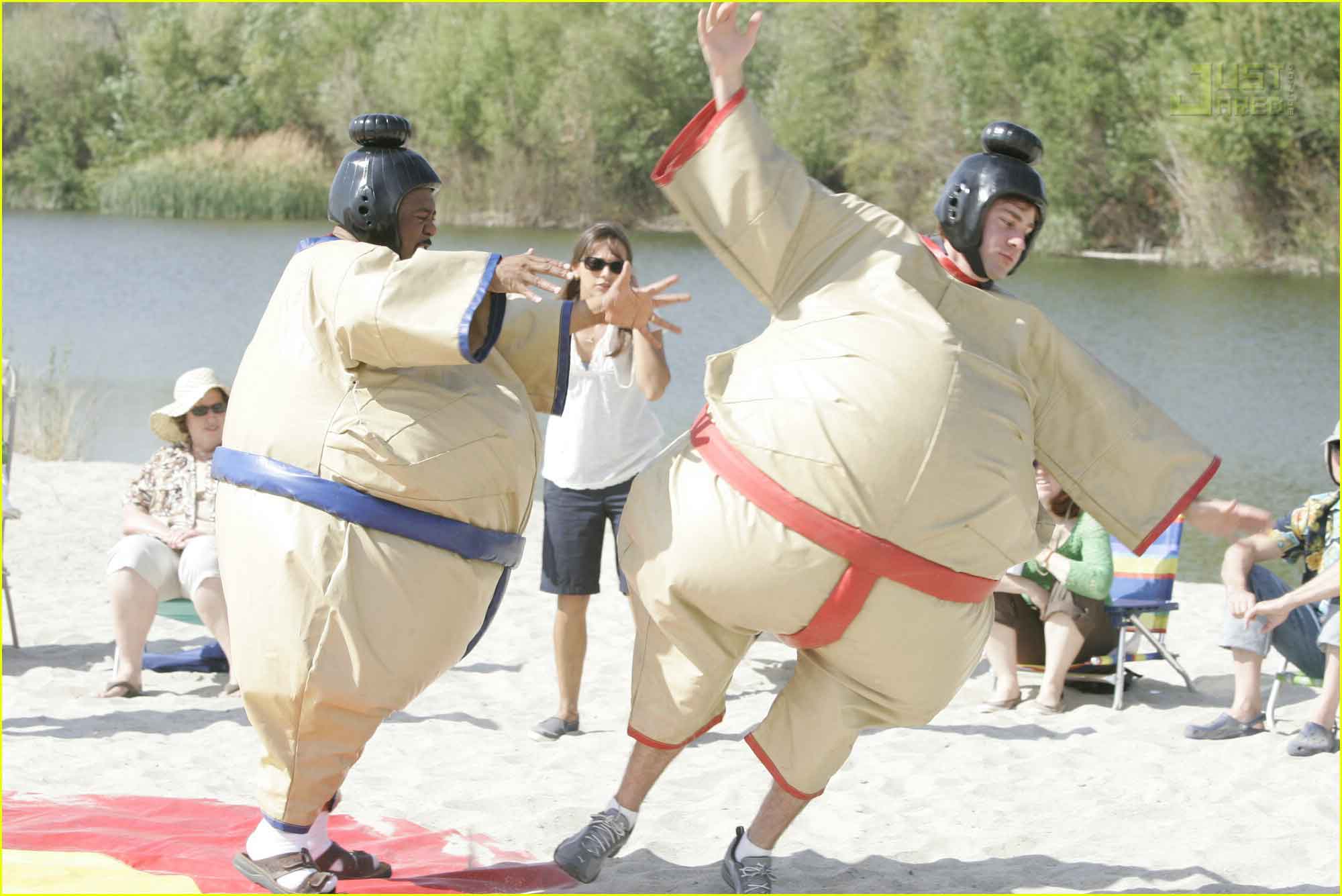 two men in sumo suits fighting for office team building games