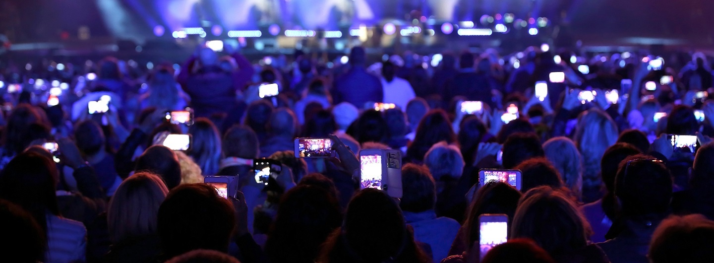 concert attendees recording the event using mobile phones
