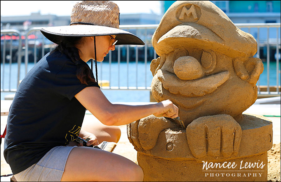 a female sand sculpting artist