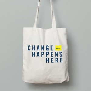 white tote bag with text on the middle