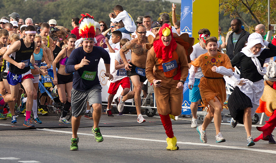 people running wearing turkey trot outfits