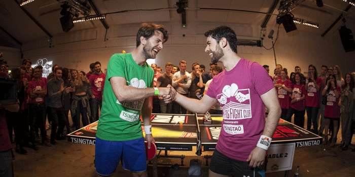 two men shaking hands with each other at gamification events