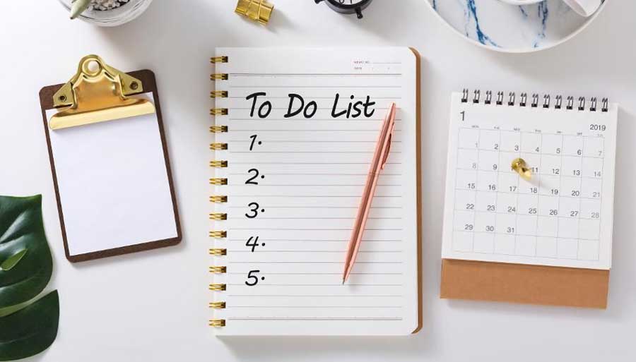 a white notepad with To Do List written on it