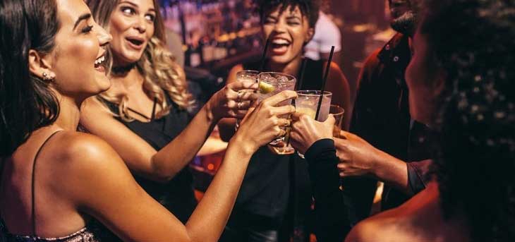 group of women having drink in a nightclub