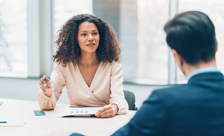 two people talking for the staff meeting