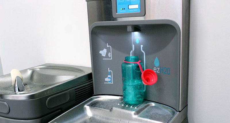 refilling a tumbler at a touchless refillable water station