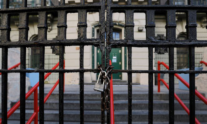 chained fence in front of a school