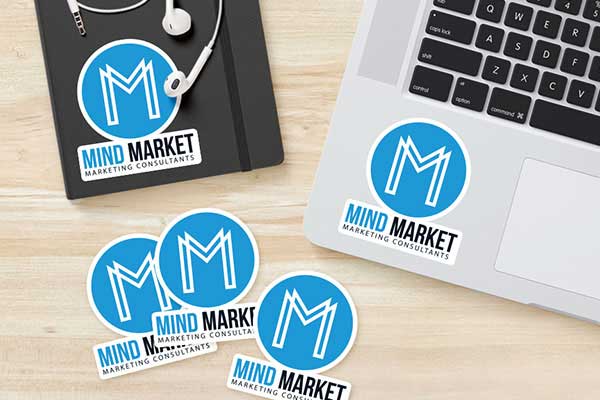 Mind Market stickers stuck on laptop and notebook