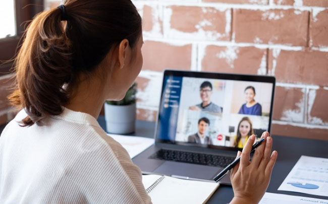 a-woman-on-her-computer-talking-to-different-people-on-the-computer