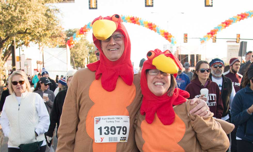 two people dressed up in turkey costumes for a race