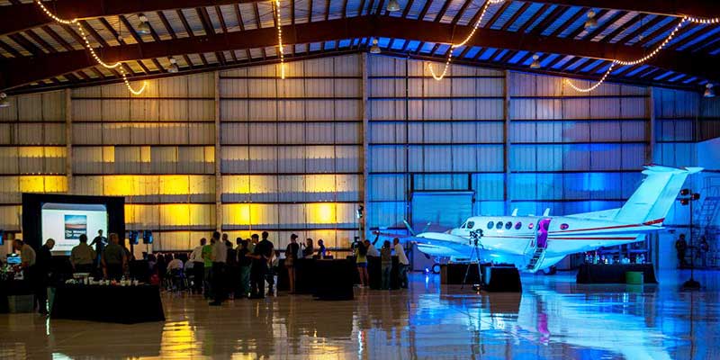 an-airport-hangar-party-with-a-plane