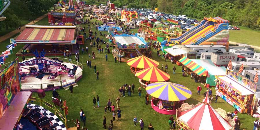 people-attending-a-fairground-event