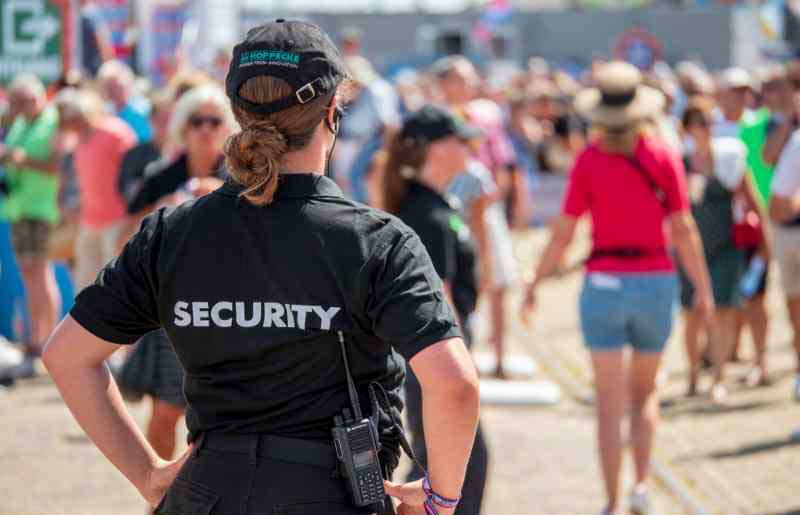 a-woman-in-a-security-uniform-at-an-event