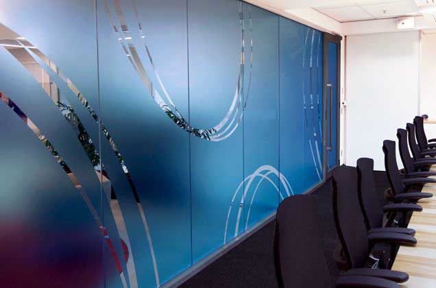 blue-glass-barrier-with-designs-on-it