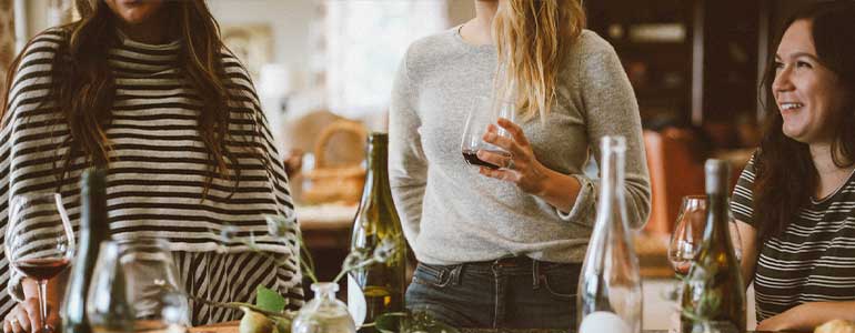 people-talking-over-wine-and-food