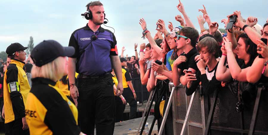 a-security-guard-looking-at-the-crowd-control
