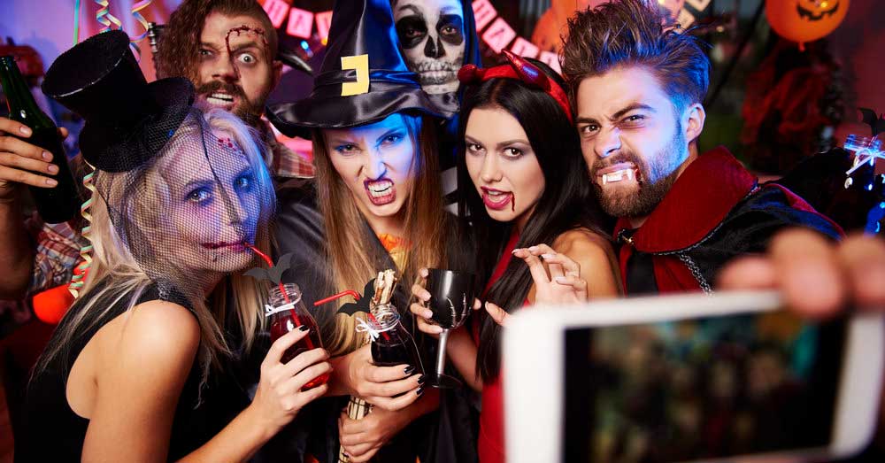 people-taking-a-photo-at-a-Halloween-costume-ball