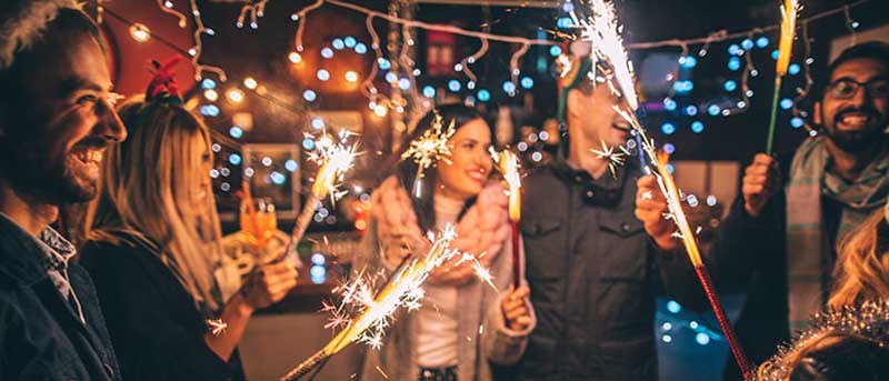 friends-holding-sparklers-at-a-New-Years-Party