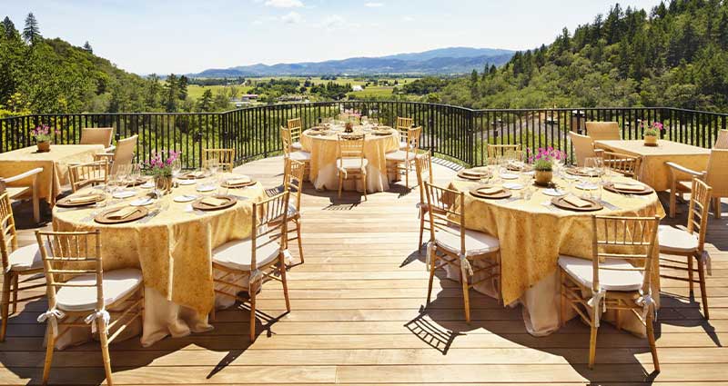 tables-on-a-deck-outside-looking-at-a-view