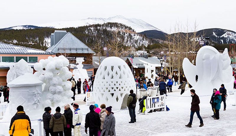 people-looking-at-ice-sculptures-at-a-resort
