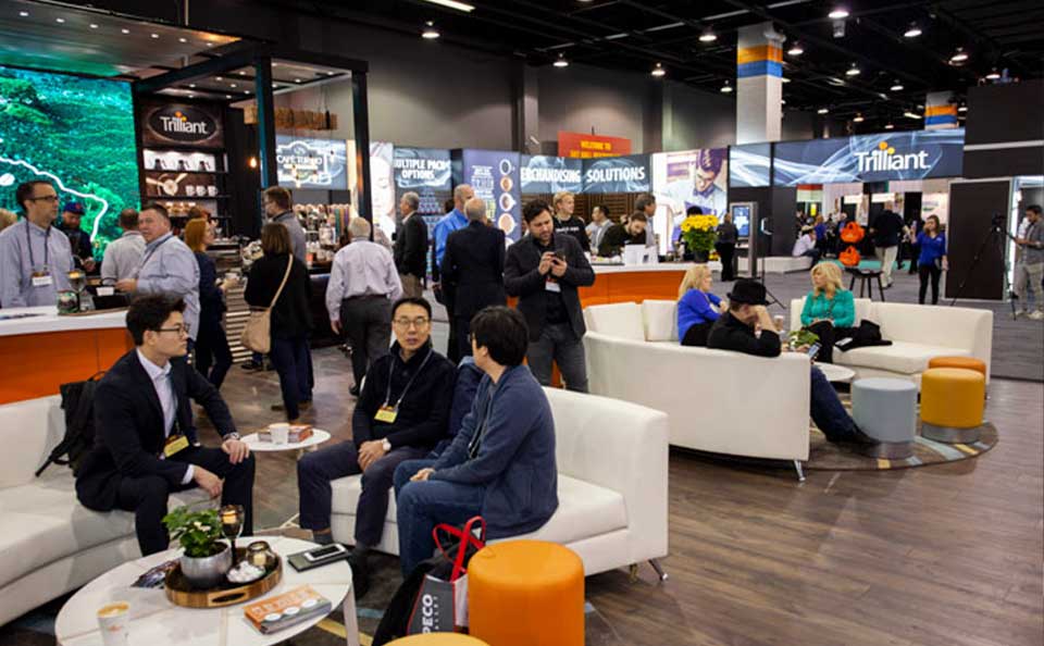 trade-show-people-sitting-down-at-booths