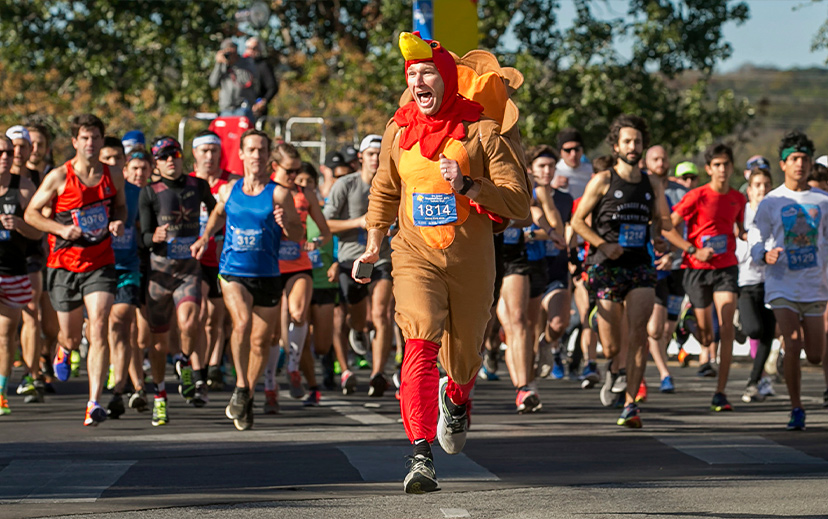 a-man-running-in-a-turkey-costume