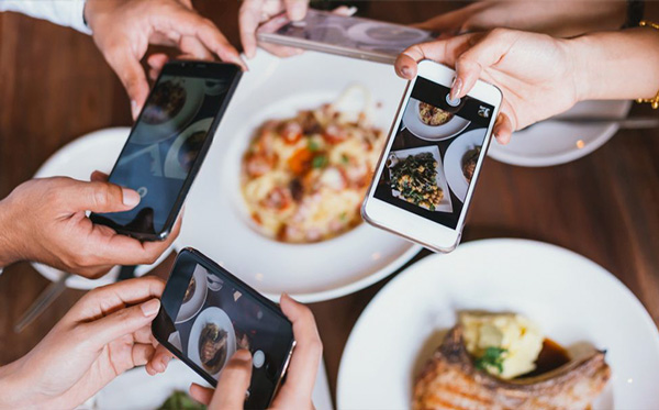 people-taking-images-of-their-food