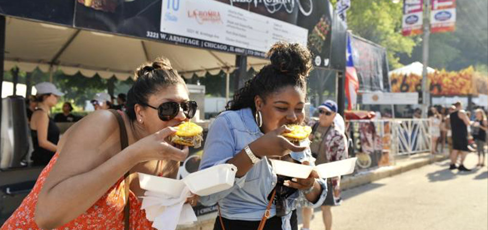 people-eating-food-at-festival