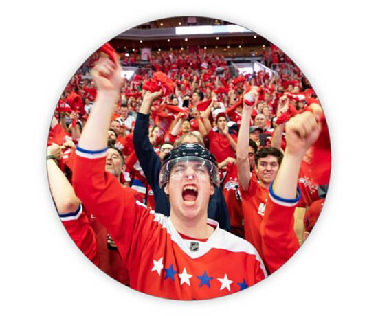 a sports fan for hockey yelling in the crowd